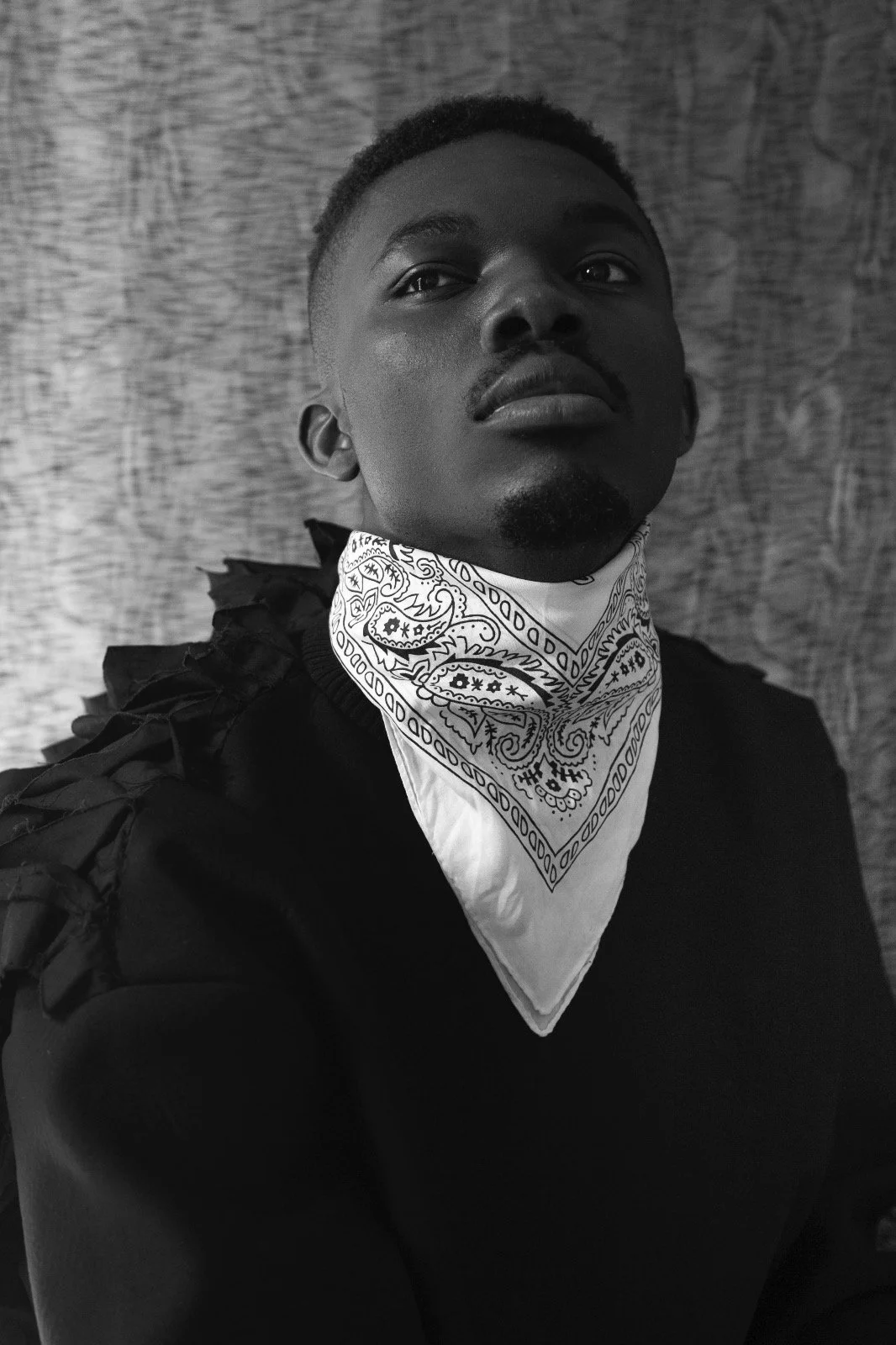 Black and white portrait of Oulouy wearing a bandana.