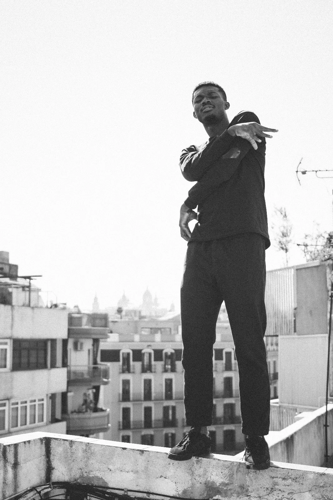 Oulouy on a rooftop in an urban area.